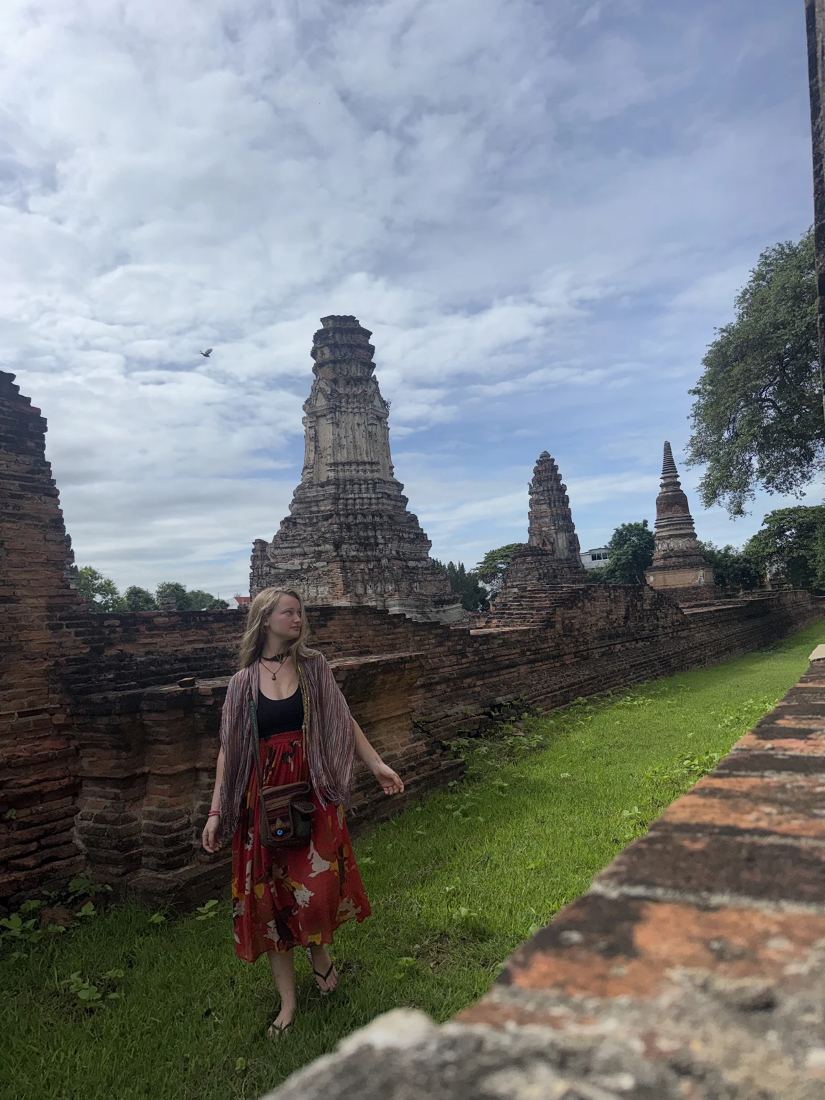 Hagar exploring historic brick temple ruins in Thailand